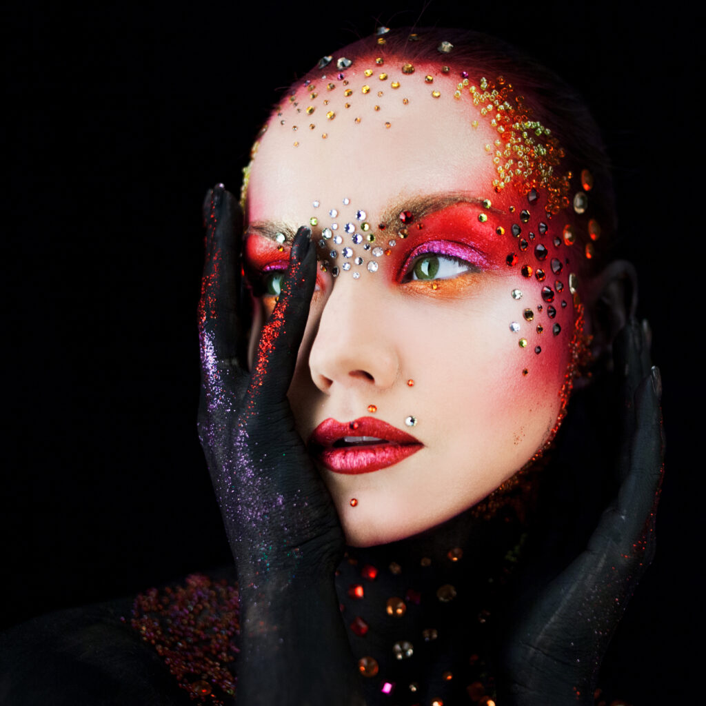 young attractive girl in bright art makeup, body painting. profile